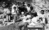 Isobel Wylie Hutchinson and crew of her umiak at lunch Tasermiut Fjord Greenland  1927