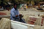 Banjul, Gambia, Boats, Man Mending Net