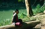 Girl on Log, North of Chiengmai, Thailand