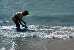 Old Man Washing Fish, Red Sea, North Yemen