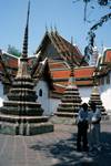 Temple of Reclining Buddha - Courtyard & 2 Figures, Bangkok, Thailand
