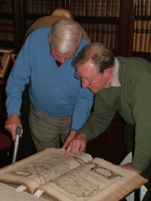 Two members of the RSGS Glasgow Centre erusing a map